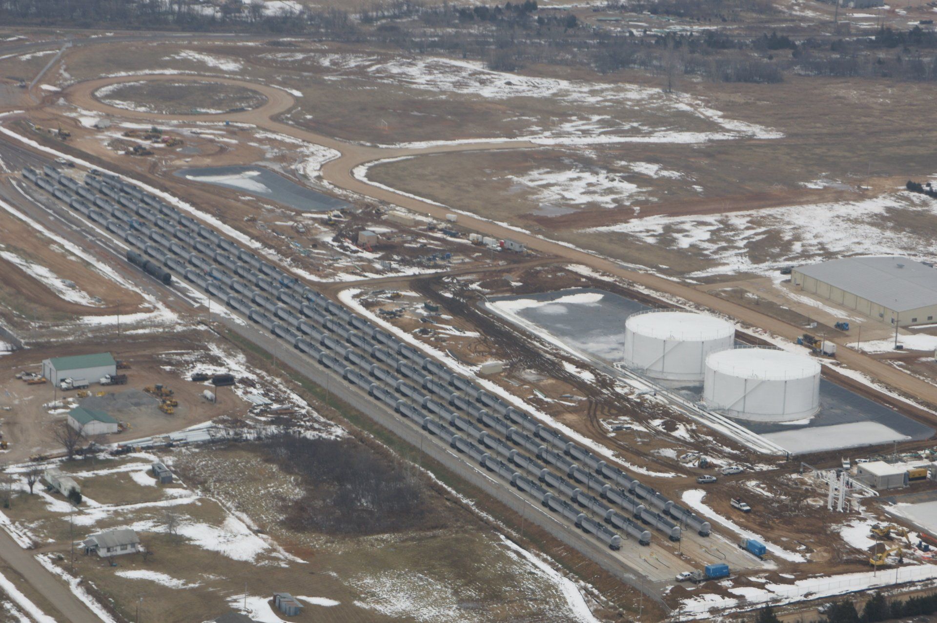 An aerial view of a train track with solar panels on it