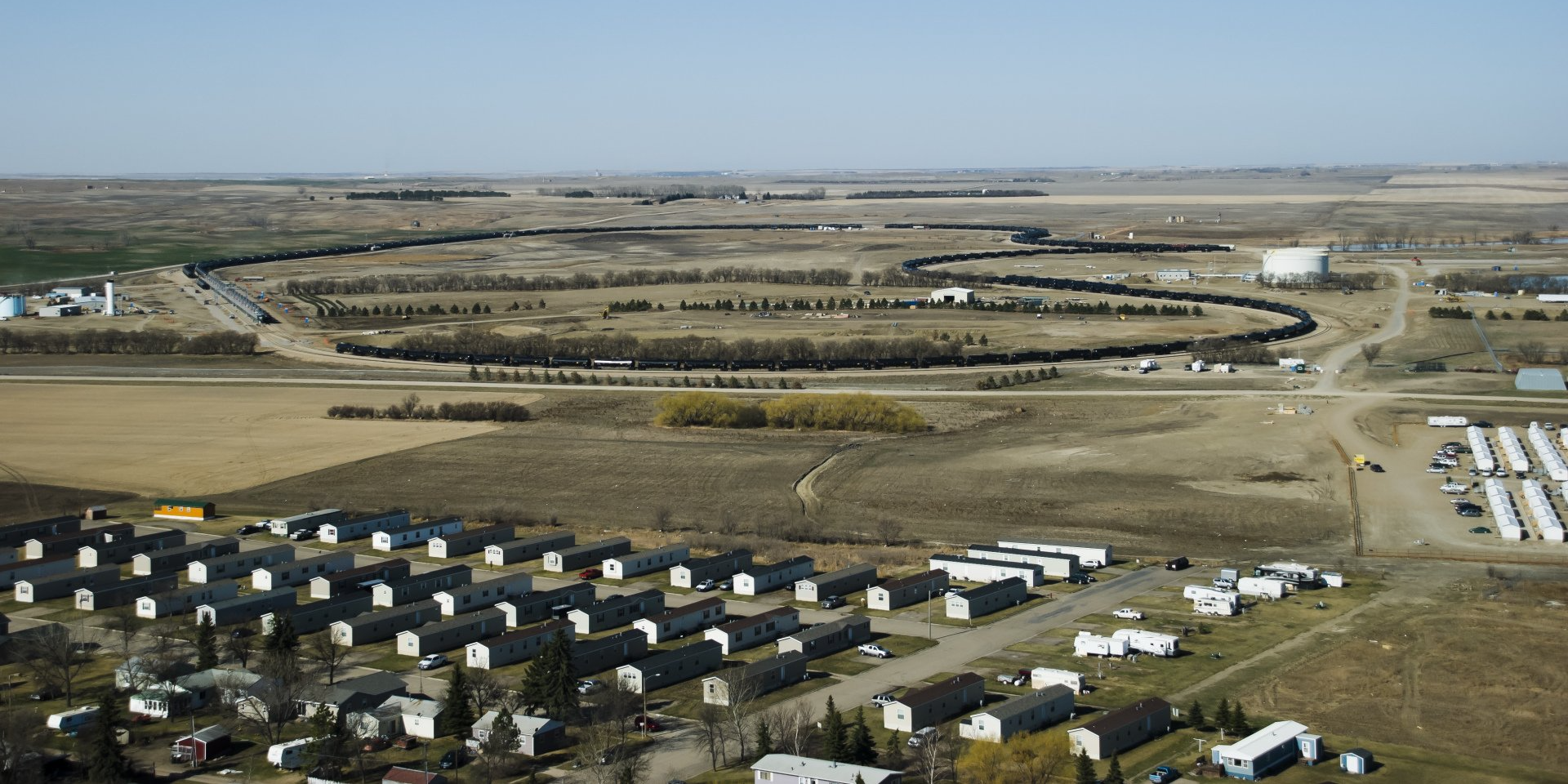 An aerial view of a small town in the middle of a field