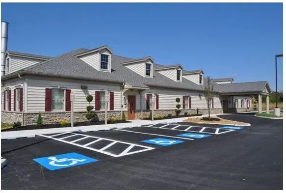 A building with a handicapped parking spot in front of it