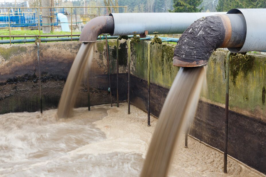 Industrial wastewater flowing into a wastewater treatment plant tank