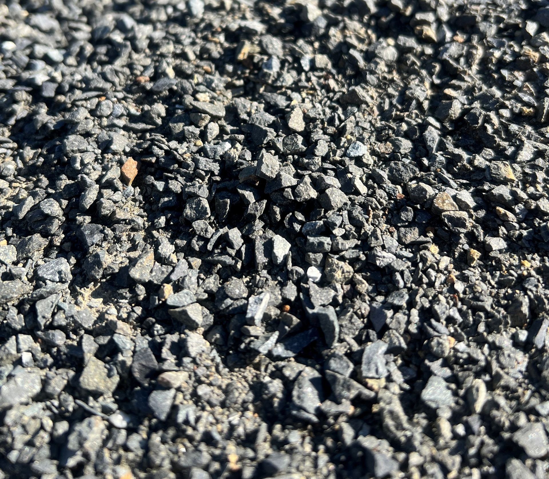 A shovel is sticking out of a pile of dirt