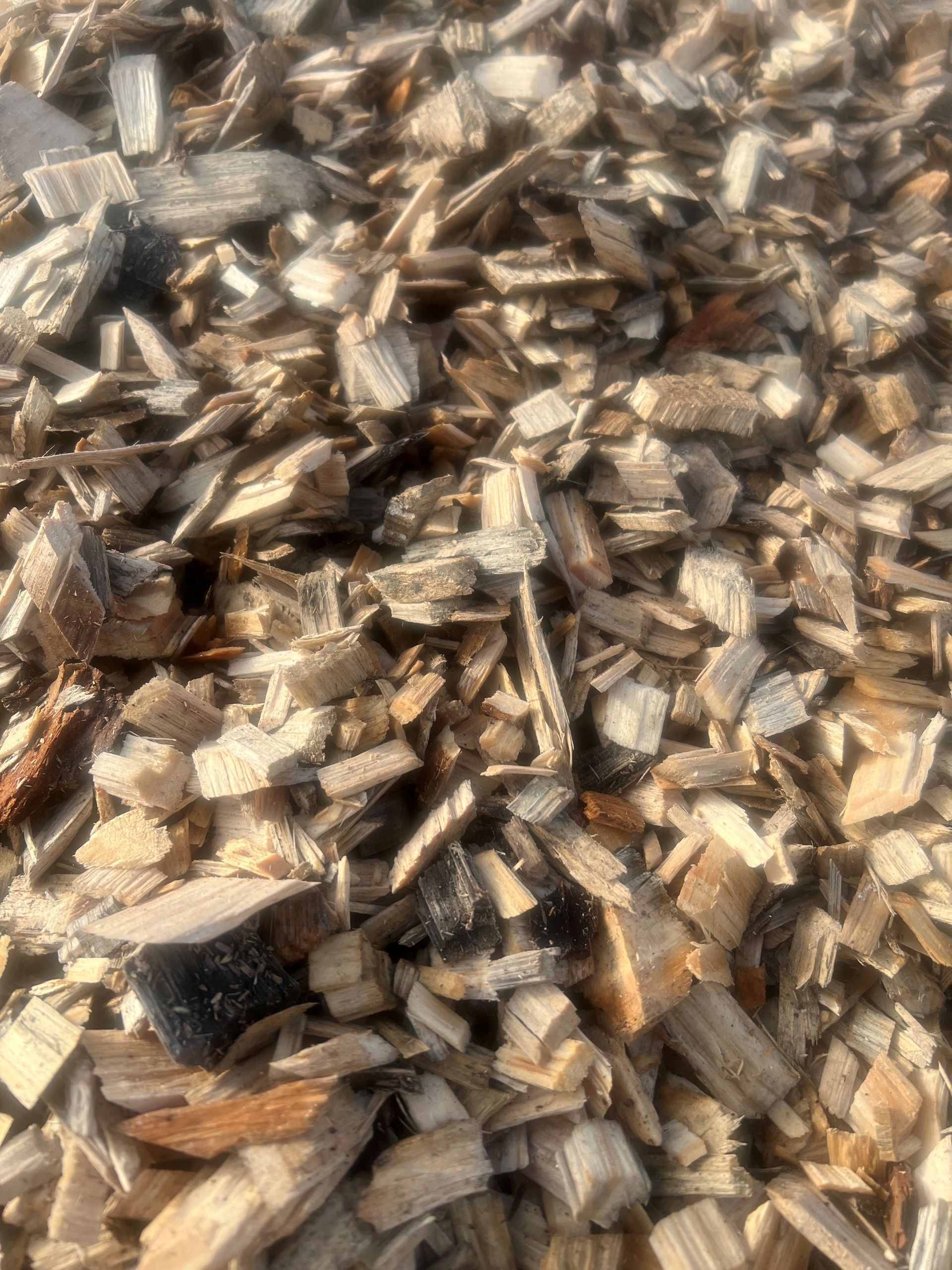 A pile of wood chips sitting on top of each other.