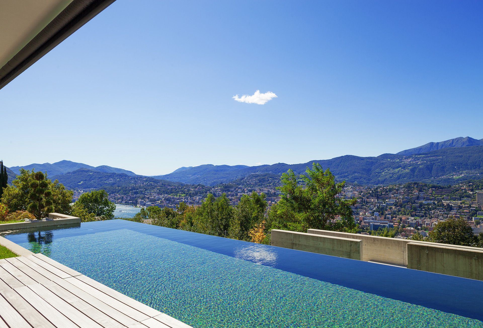there is a swimming pool with a view of the mountains