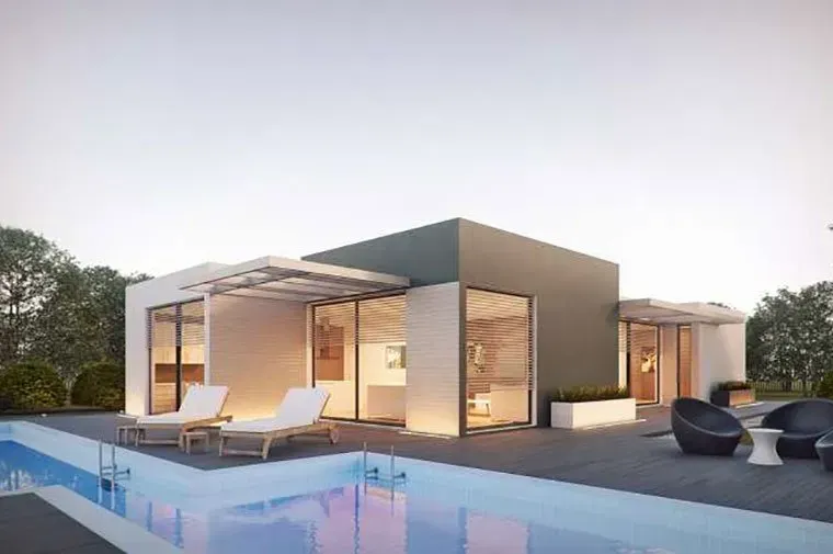 a modern house with a swimming pool in front of it