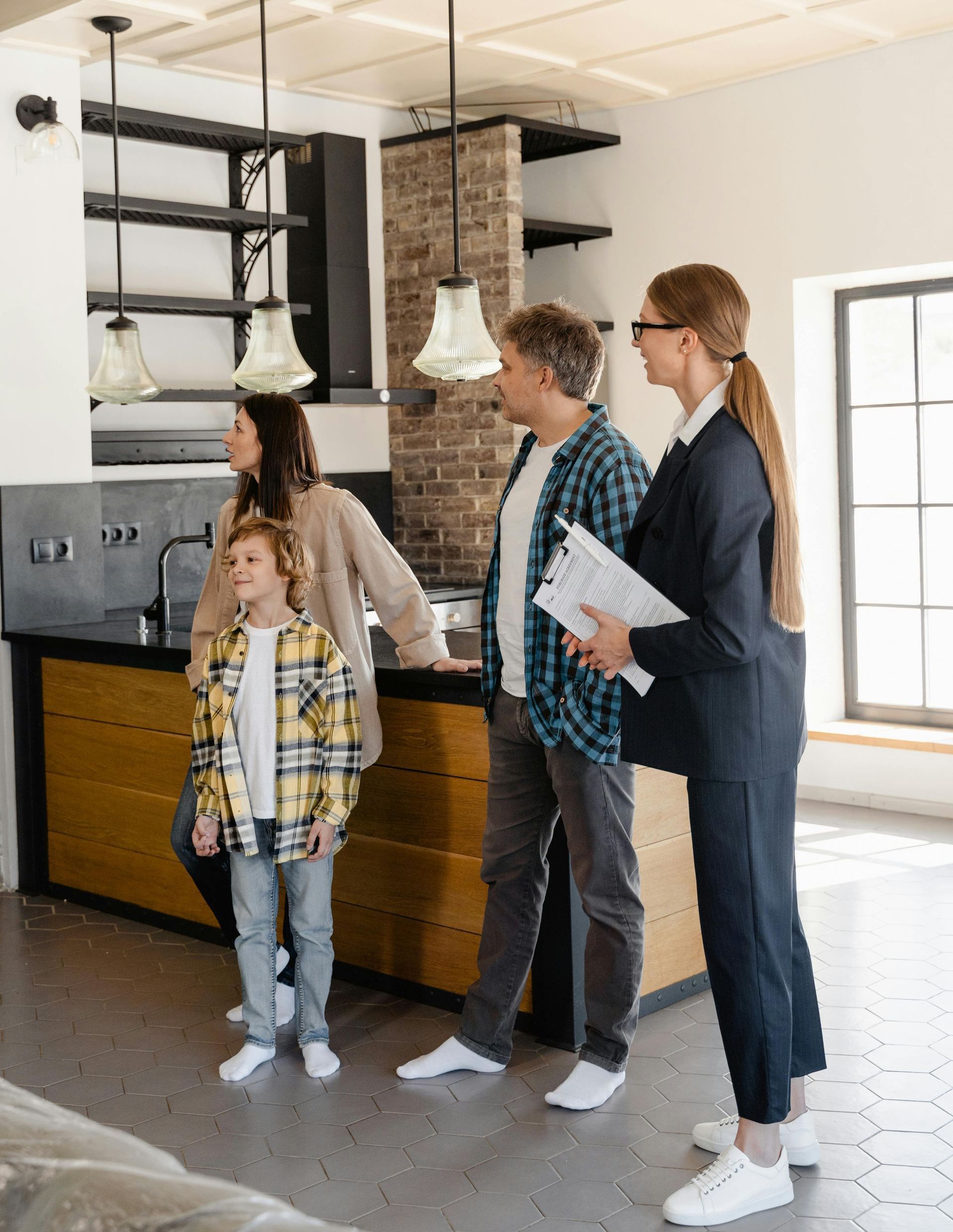 realtor and woman signing house purchase with a mortgage broker