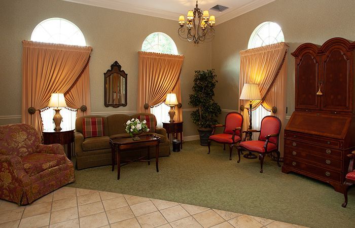 A living room filled with furniture and a chandelier