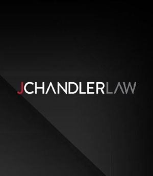 JCHANDLERLAW logo in white and red on a dark gray background.