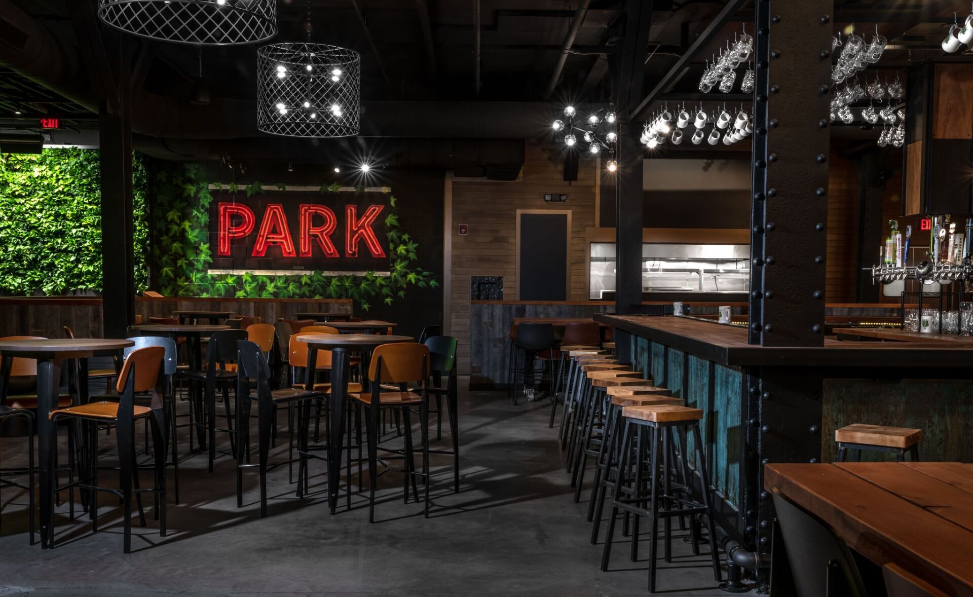 A restaurant with tables and chairs and a sign that says park on the wall.