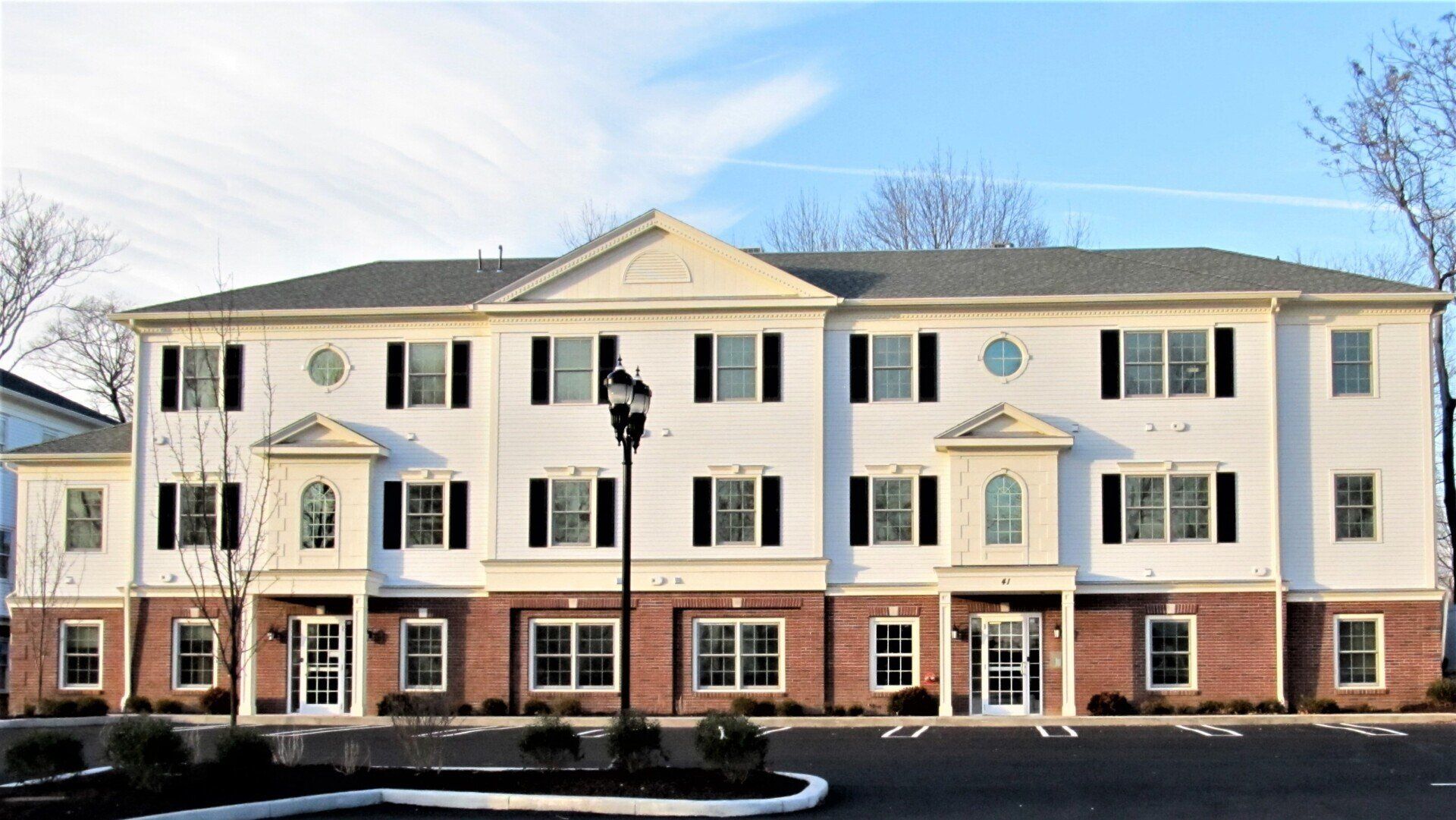 A large apartment building with a lot of windows