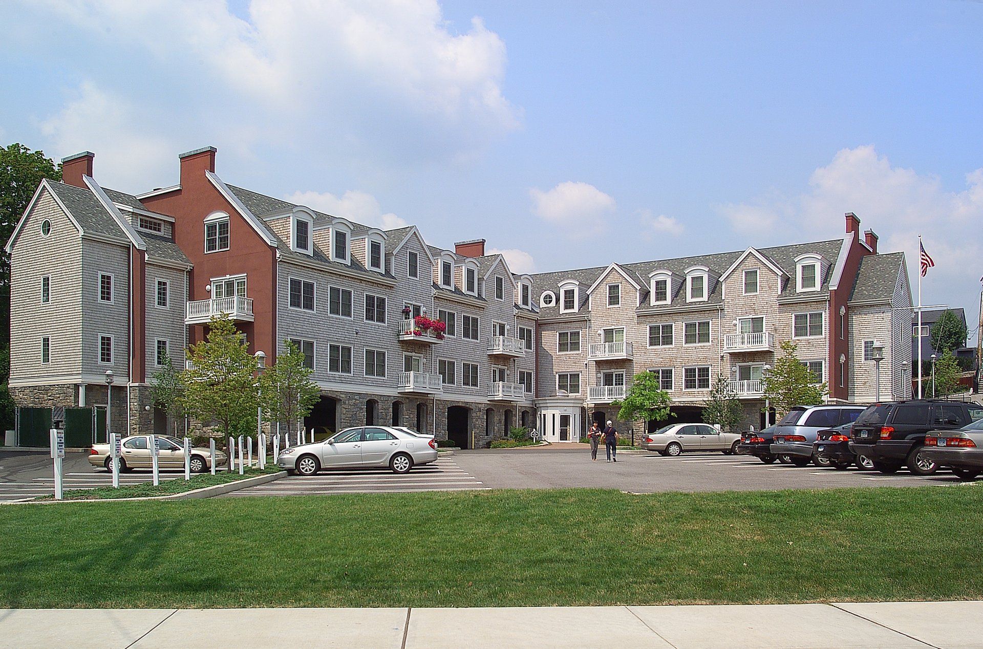 A large building with cars parked in front of it
