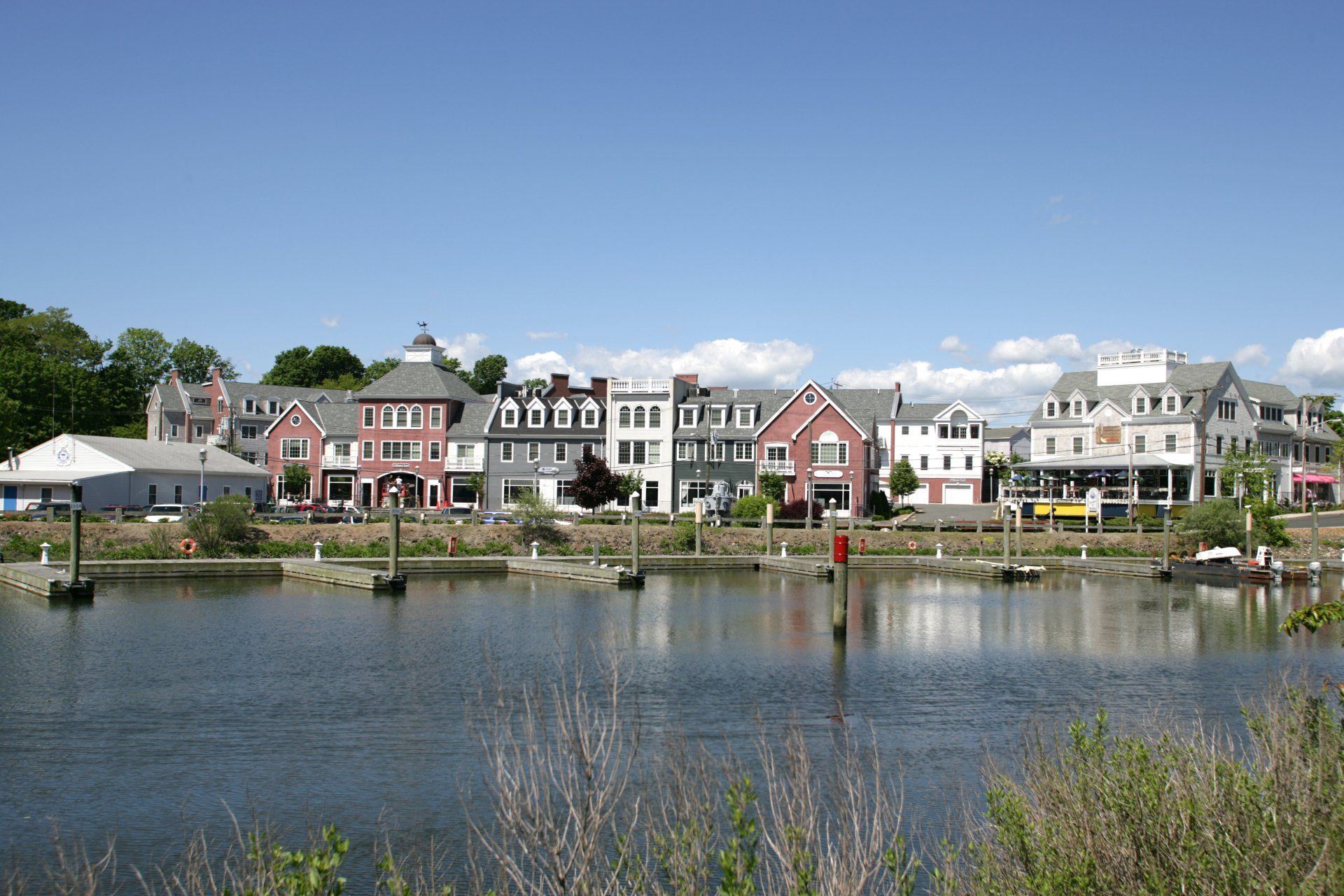 A row of houses next to a body of water