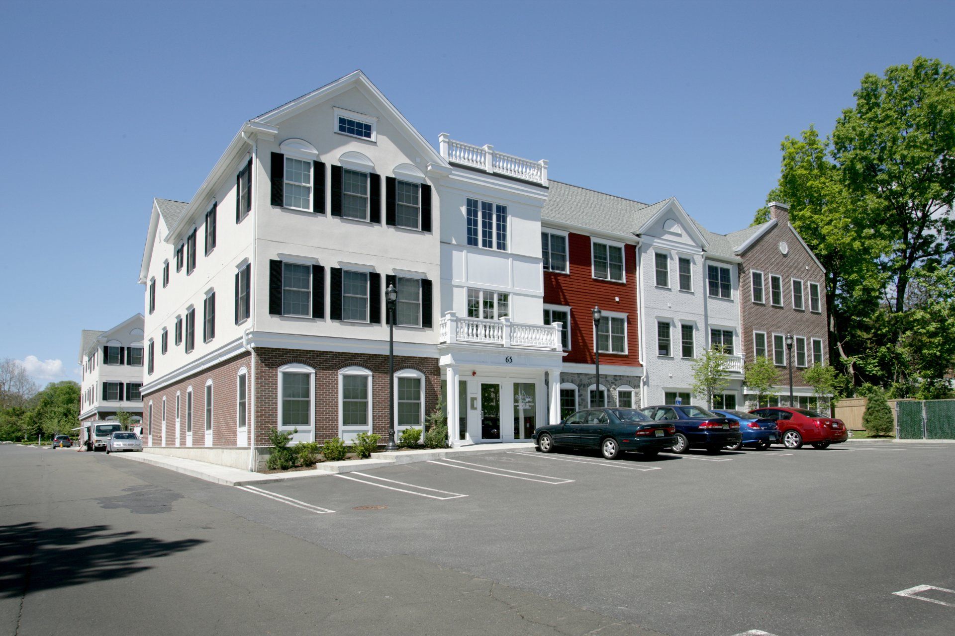 A large building with cars parked in front of it