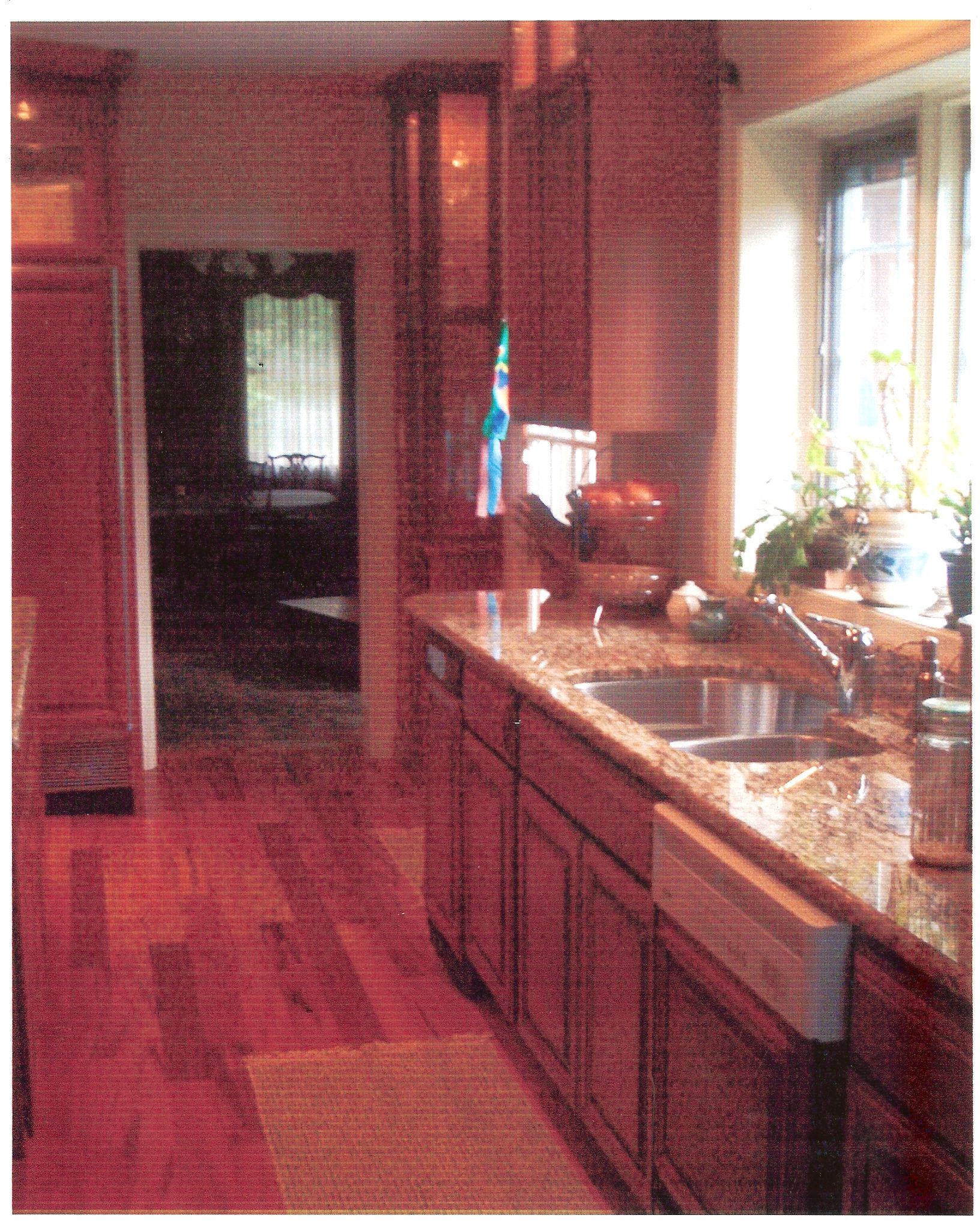 A kitchen with two sinks and a window