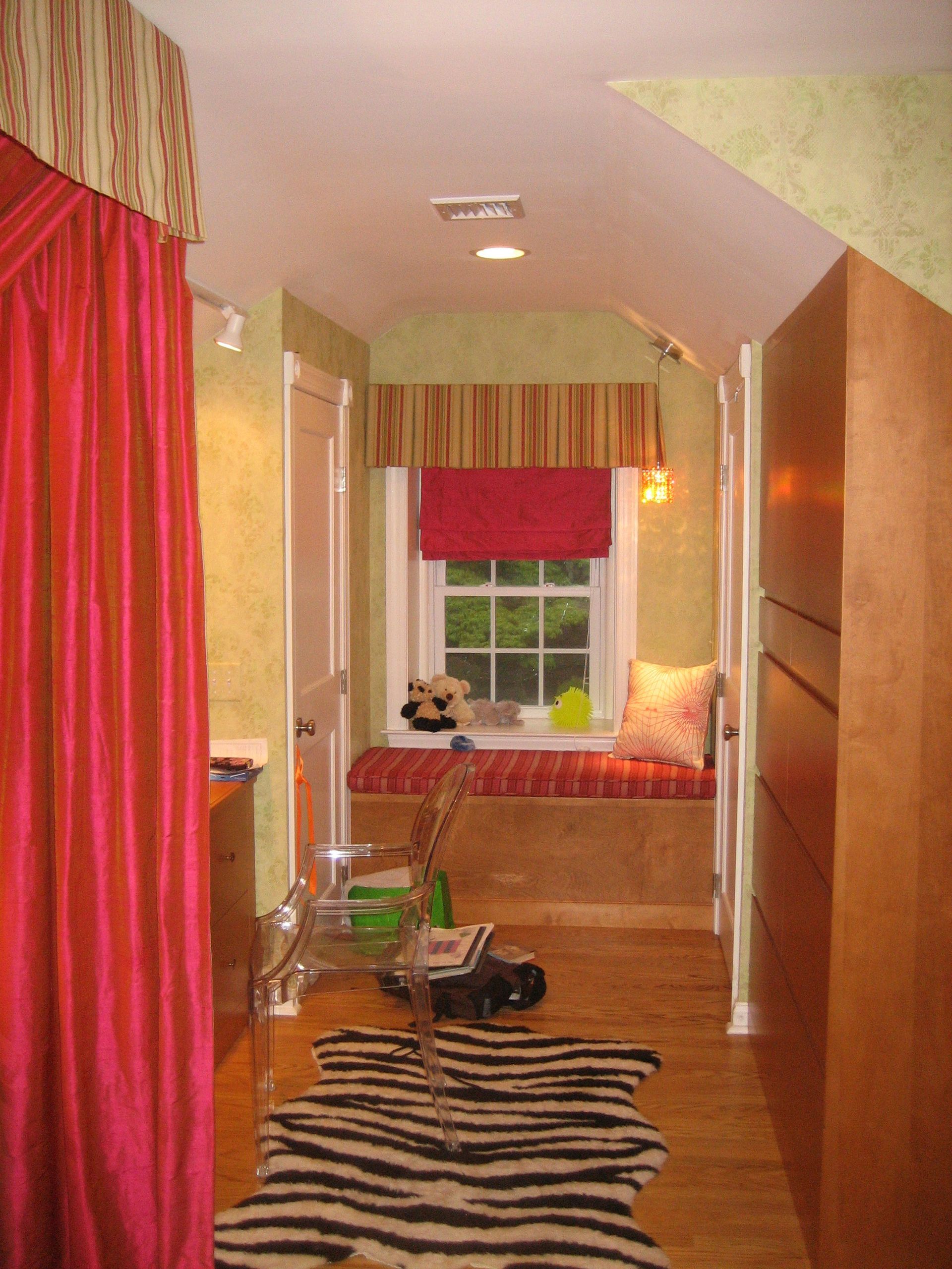 A hallway with a zebra print rug on the floor