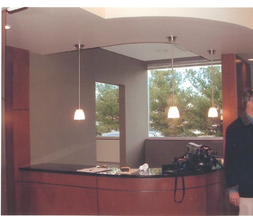 A man standing in front of a counter in a room