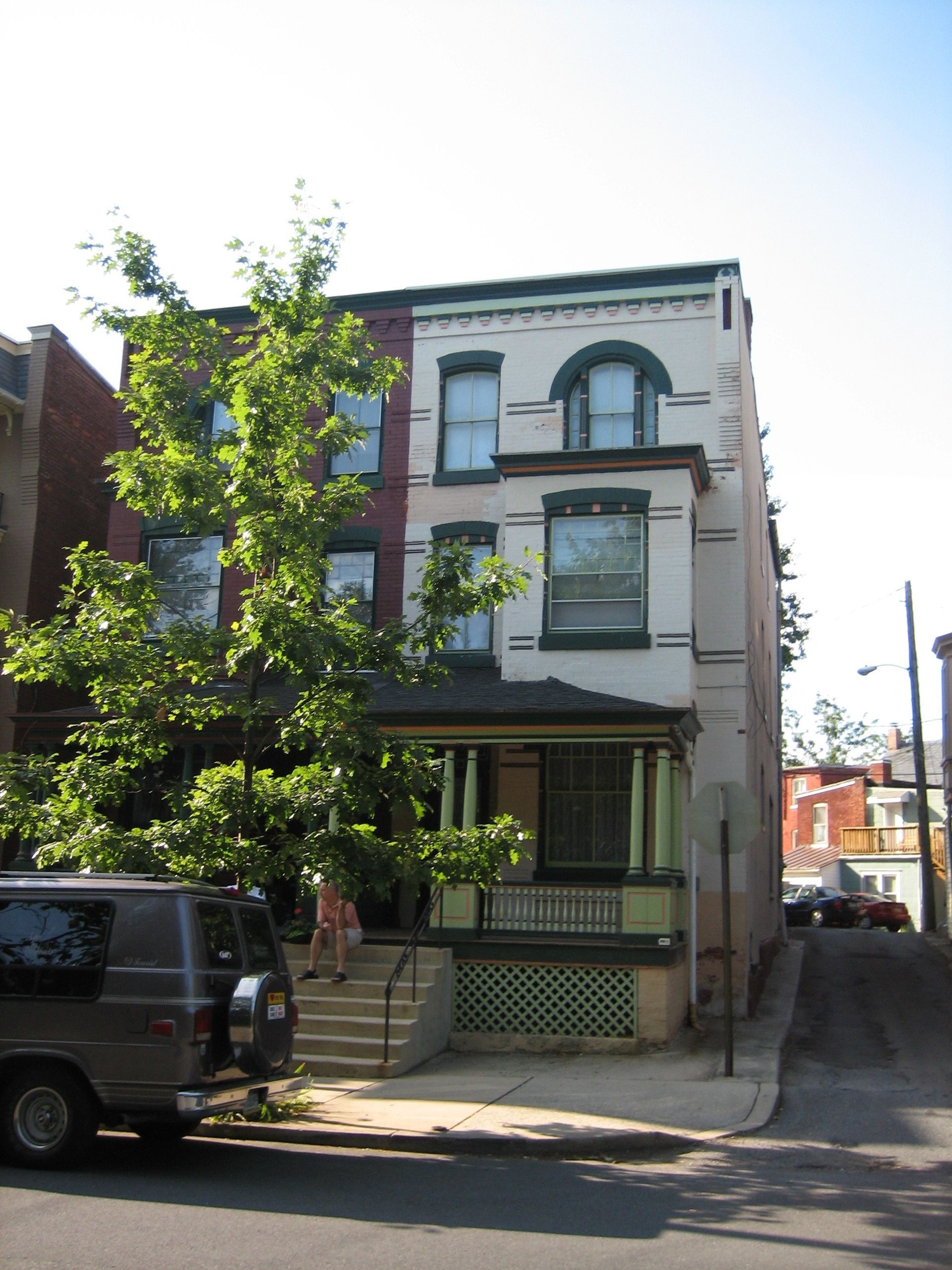 A van is parked in front of a building