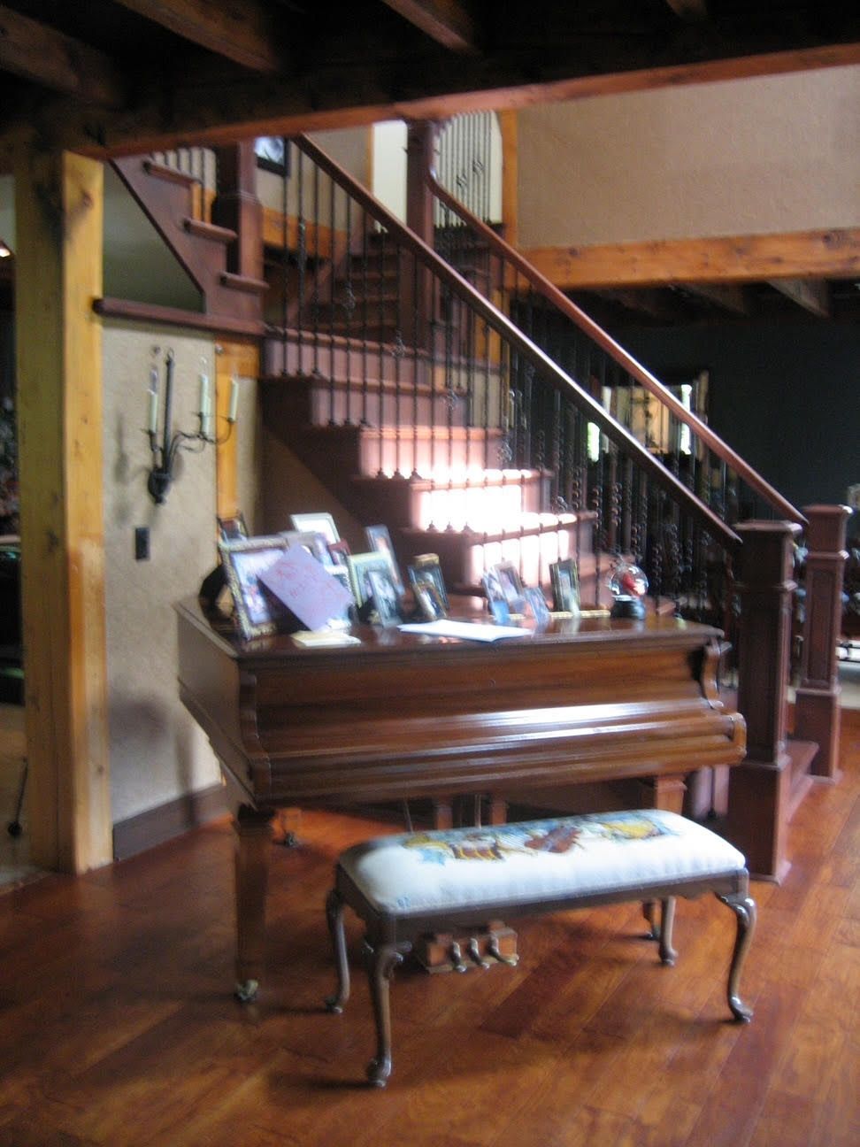Piano Near Wooden Stairs