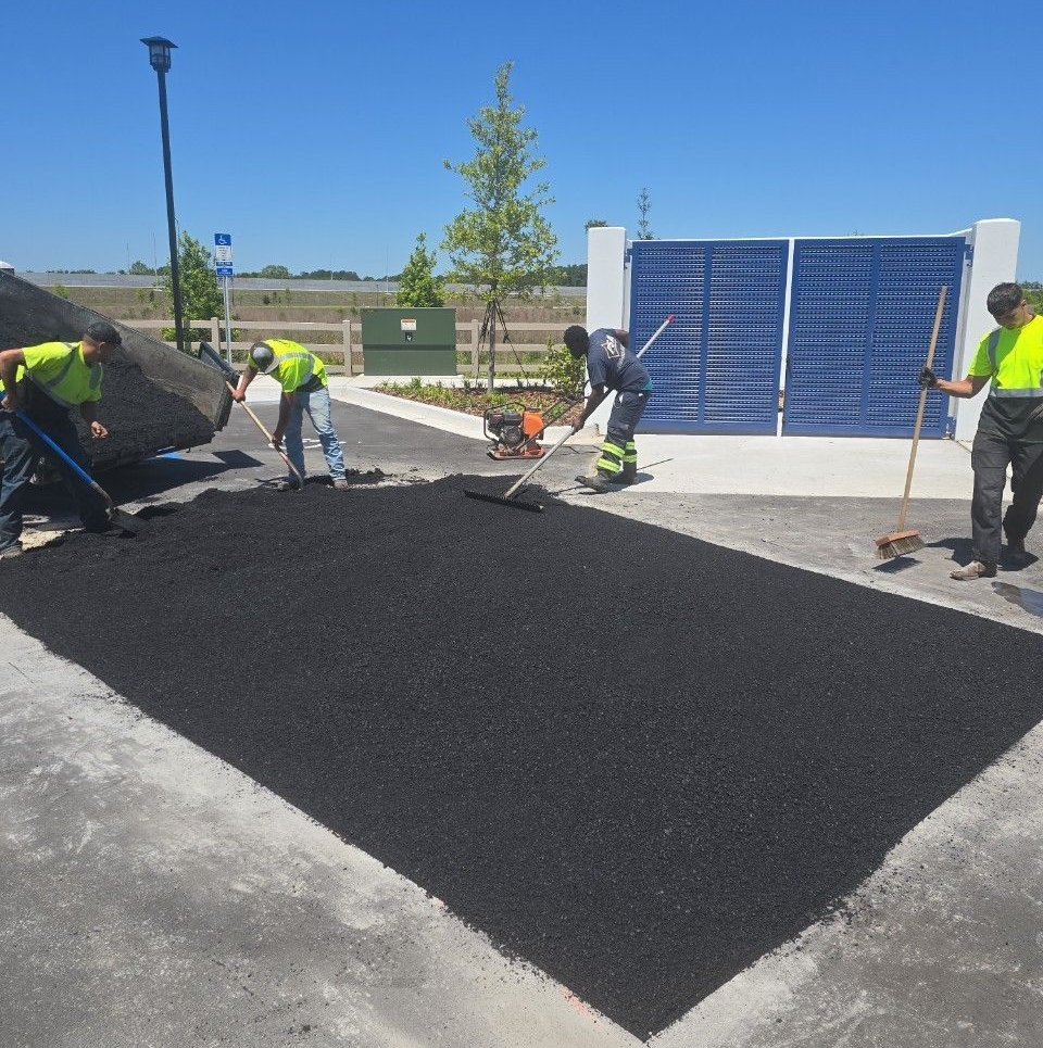 Man Repairing Asphalt Paving — Jacksonville, FL — Pro Sealed Asphalt Inc.