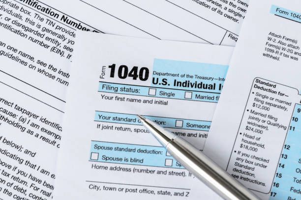 Individual tax form with a pen on top