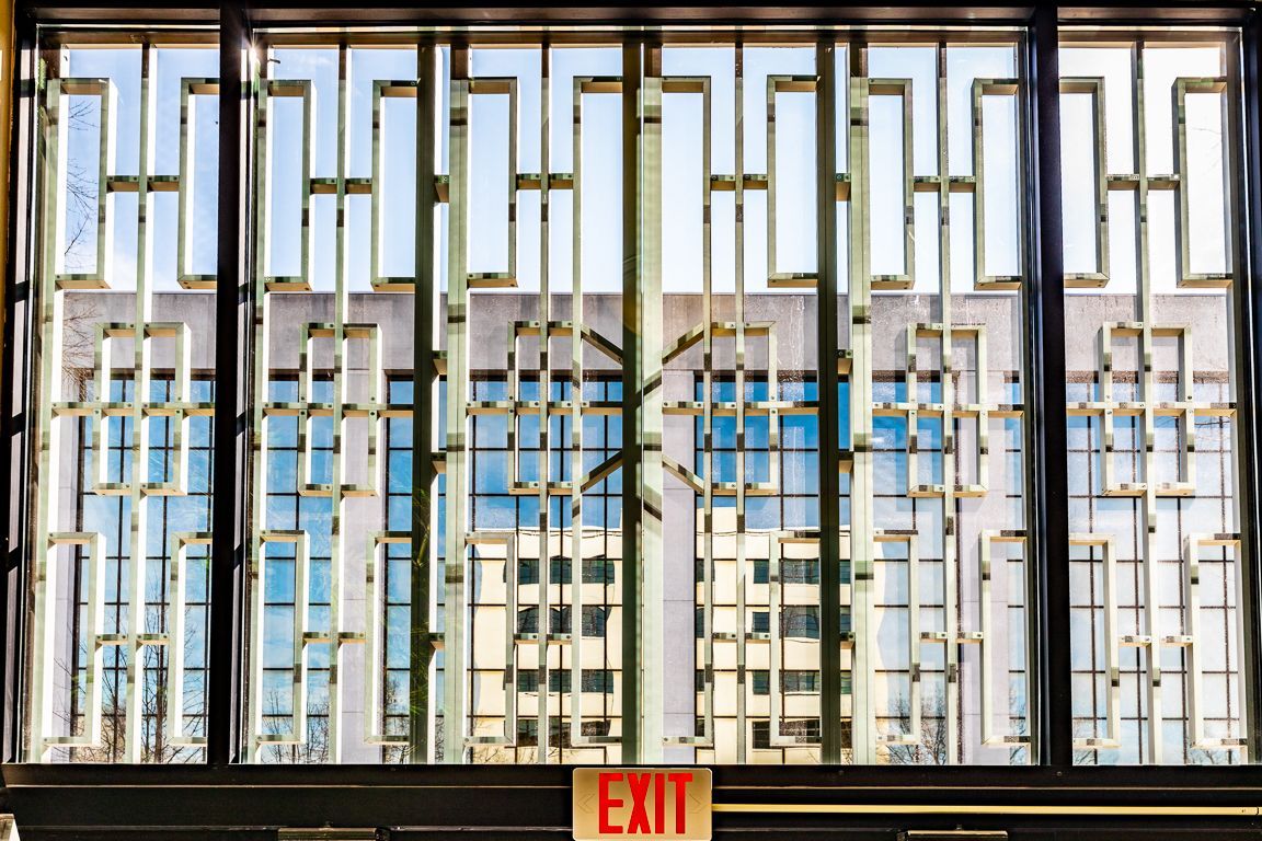 Window with decorative metal grilles, showing an