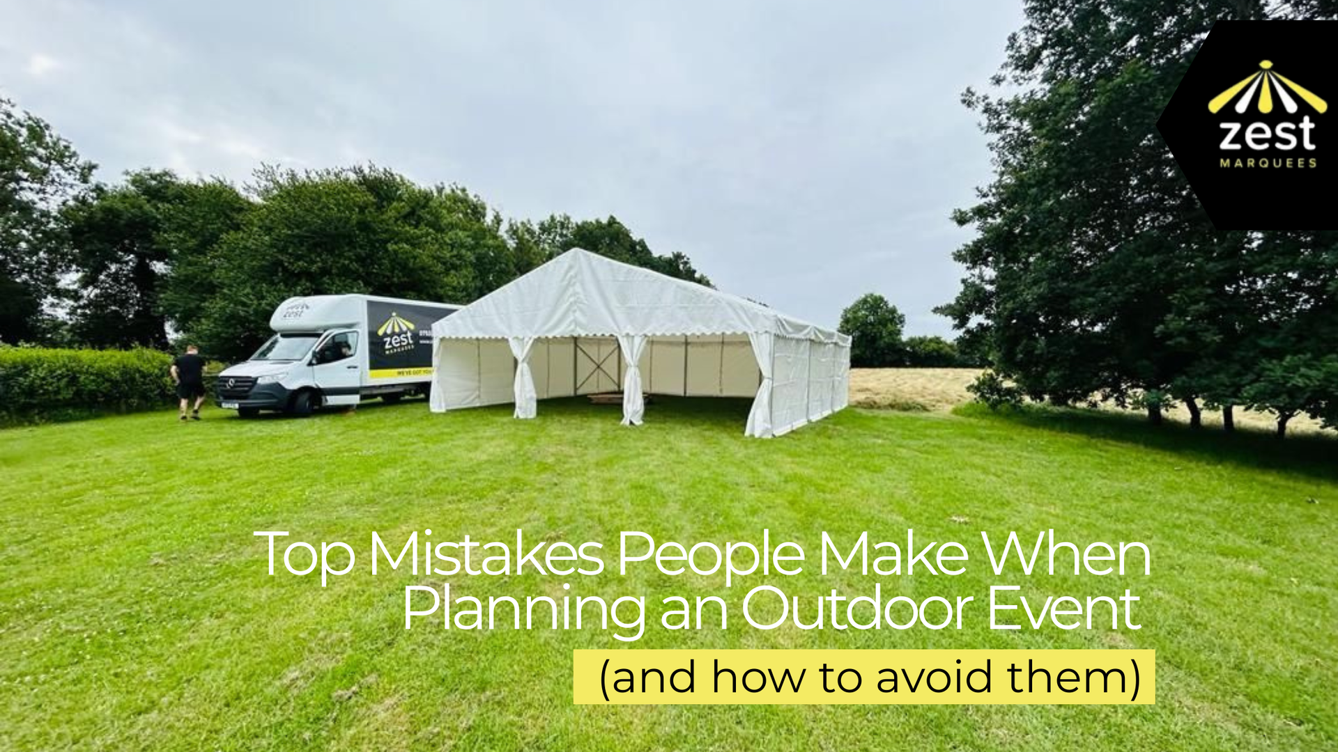 Inside a white tent, text reads 