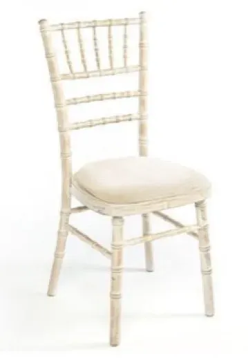 A white chair with a white cushion on a white background.