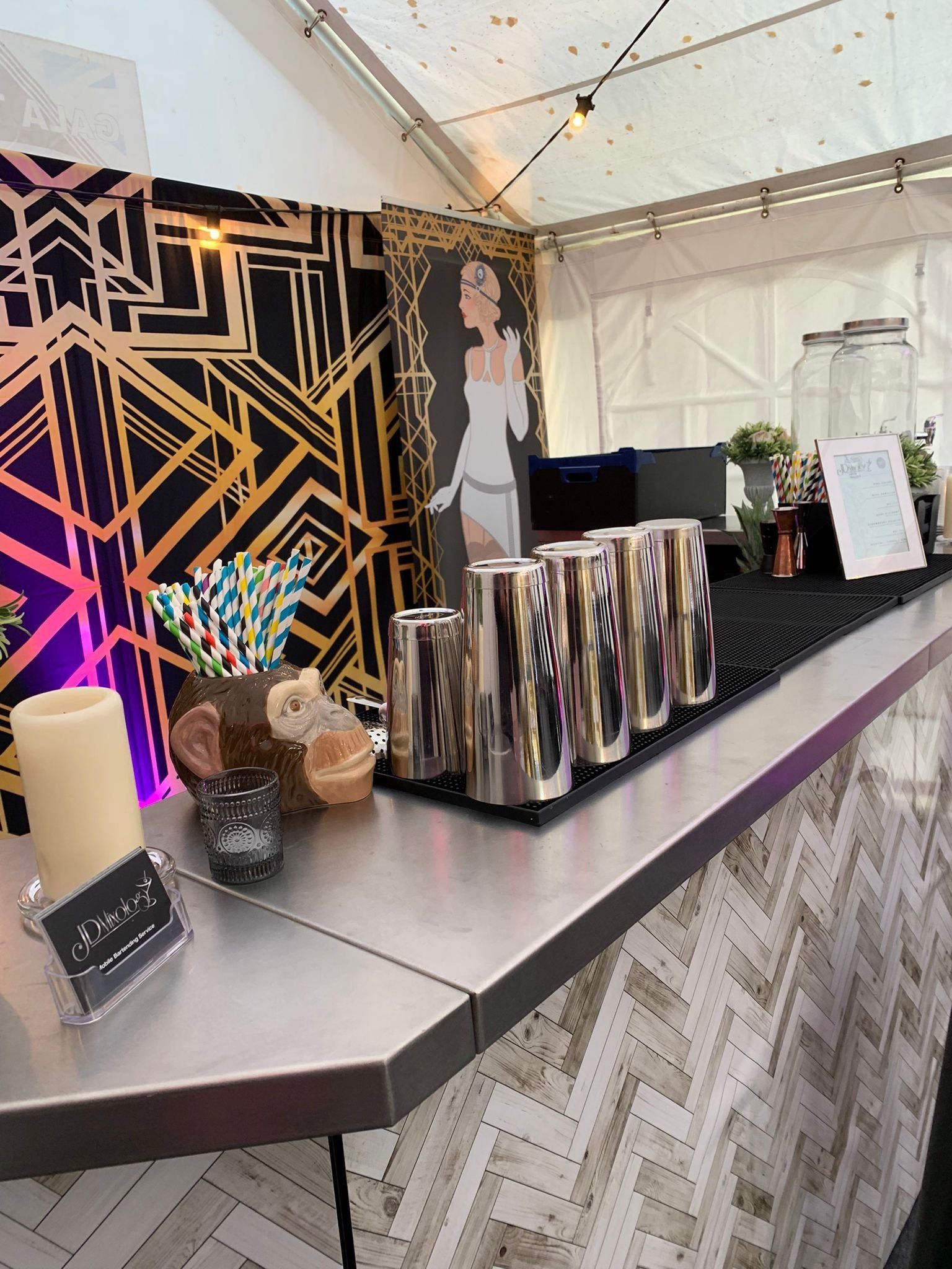 A bar with a lot of cans and candles on it.