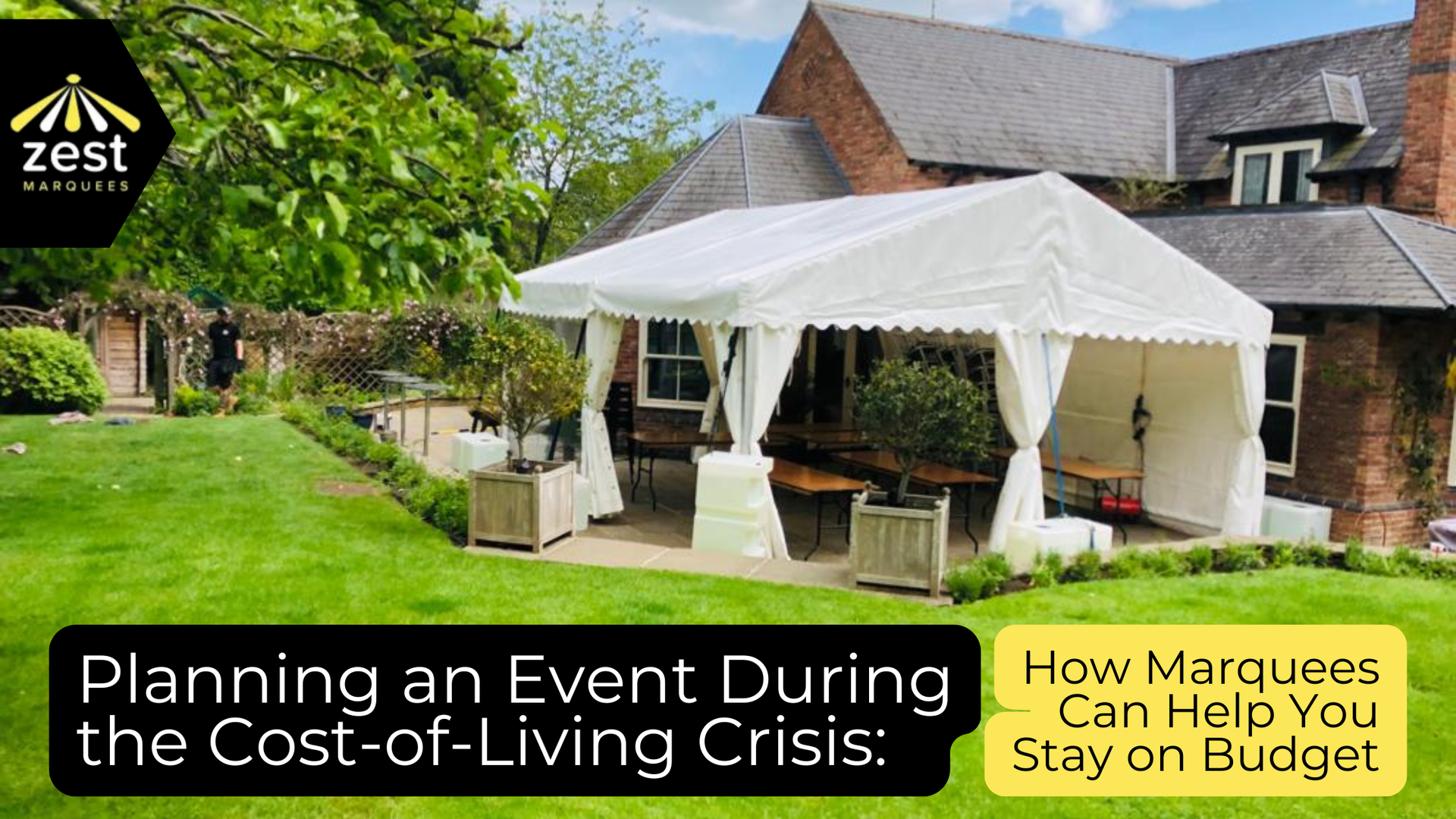 A white marquee tent set on a patio, with text about planning budget-friendly events during a cost-of-living crisis.