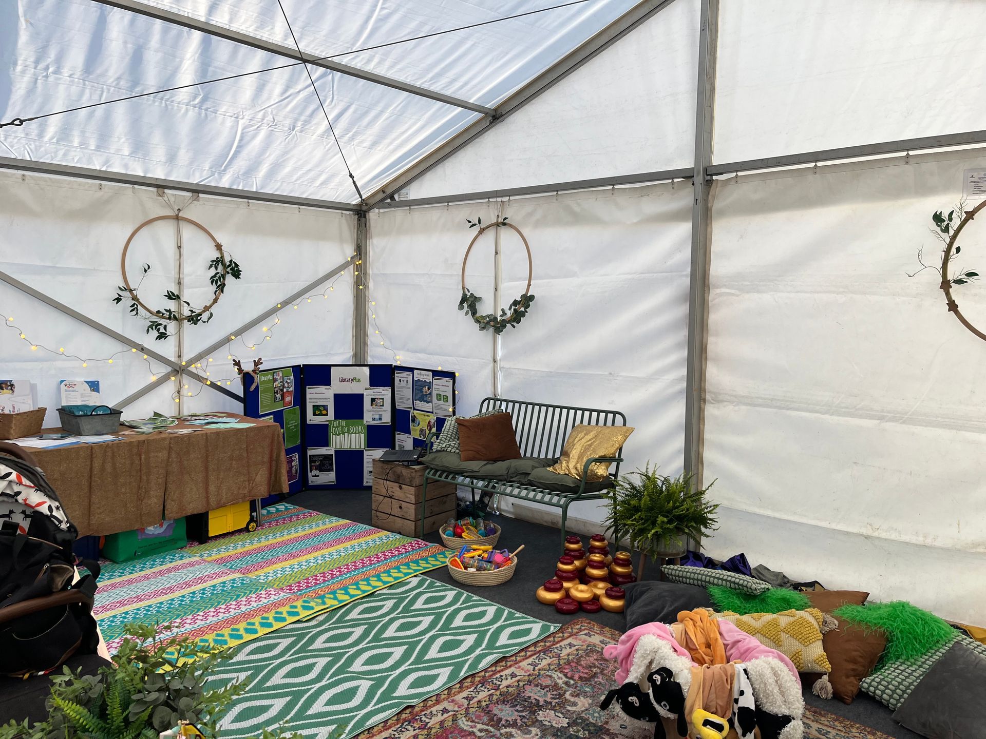 A tent with a couch and a table inside of it.