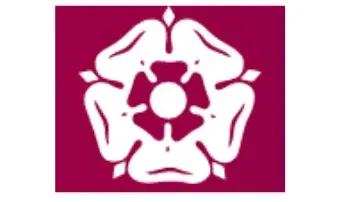 A white flower is on a red background.