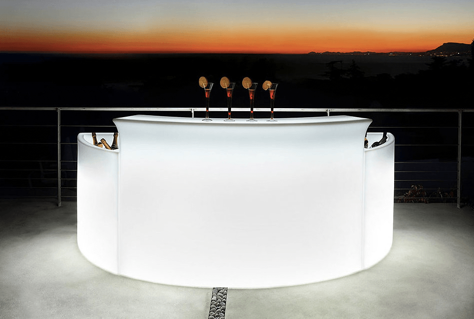 A white bar with a sunset in the background