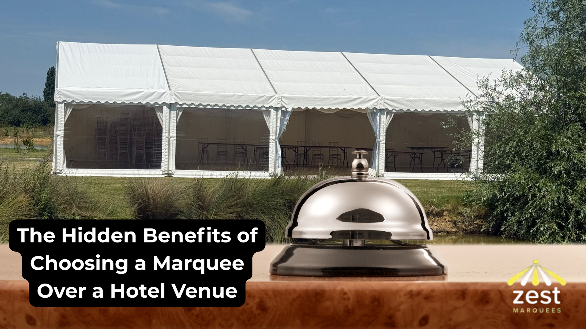Marquee with bell on a table. Text: 