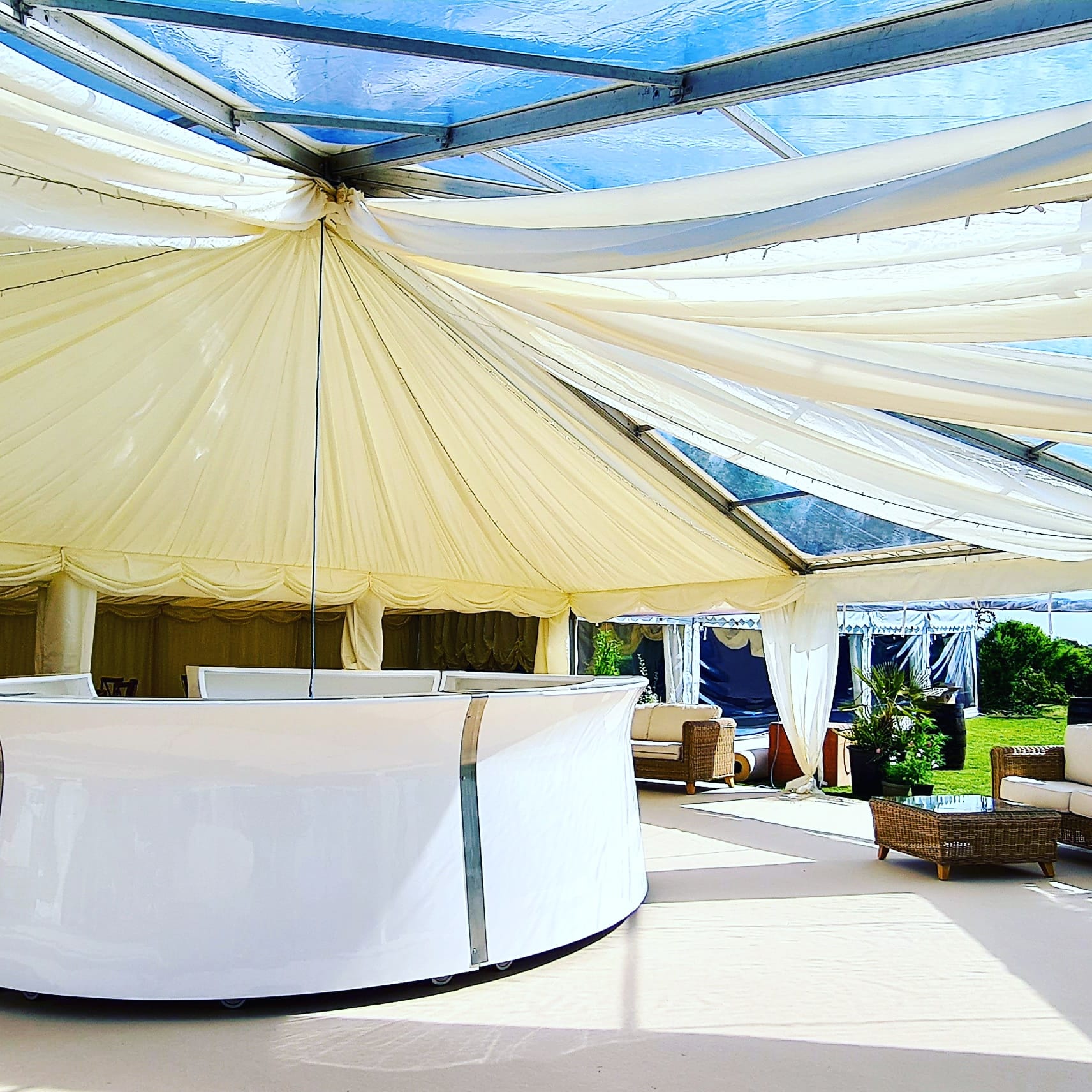 A large white tent with a clear roof