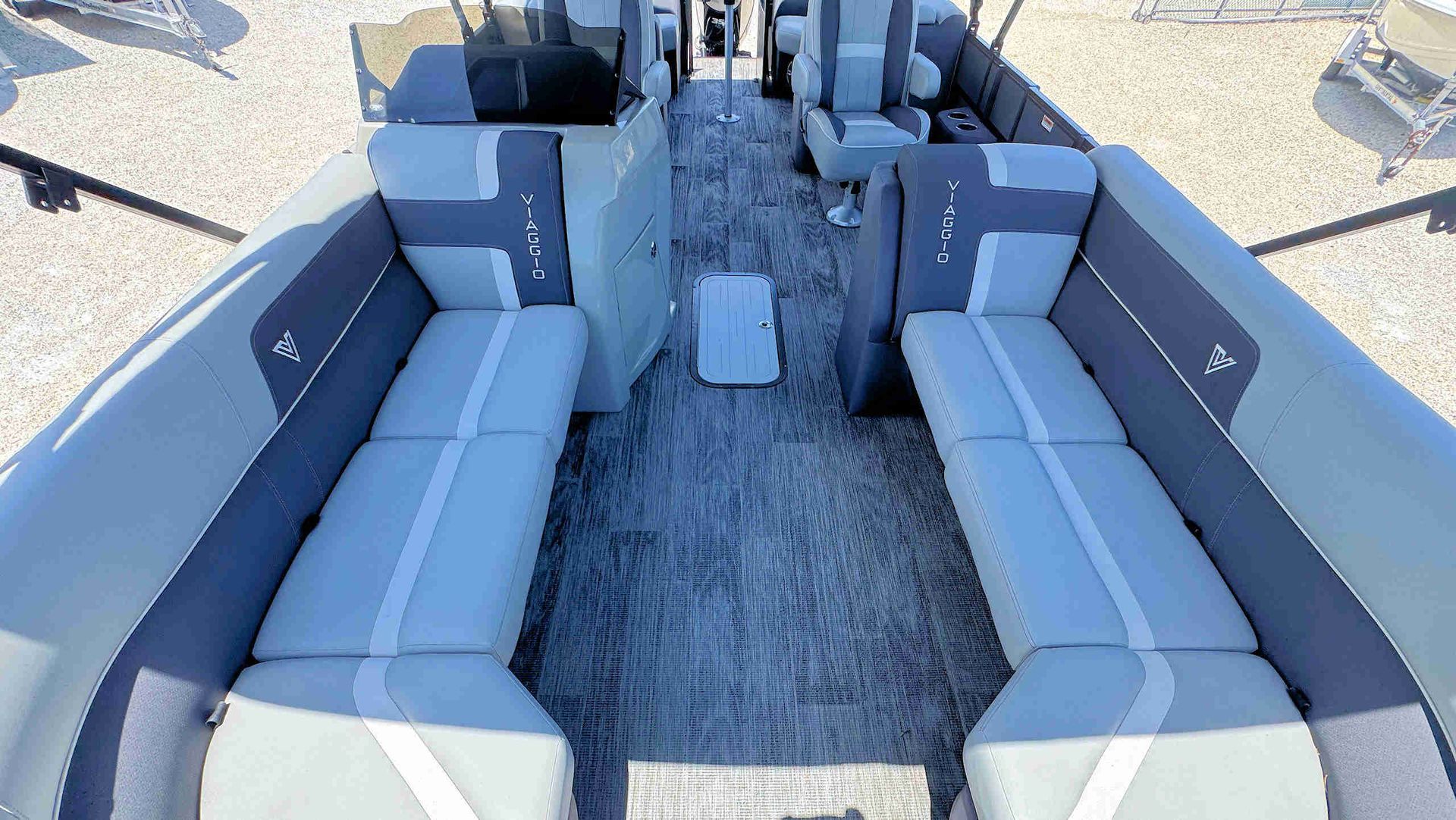 Gray U-shaped boat seating around a central deck, viewed from above.