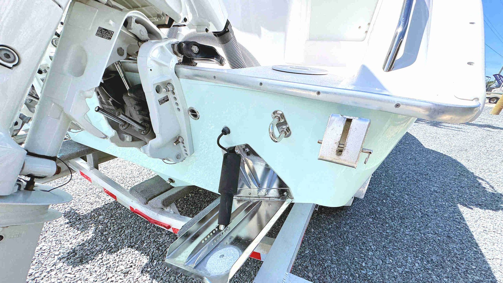 Outboard motor mounting brackets and associated equipment
