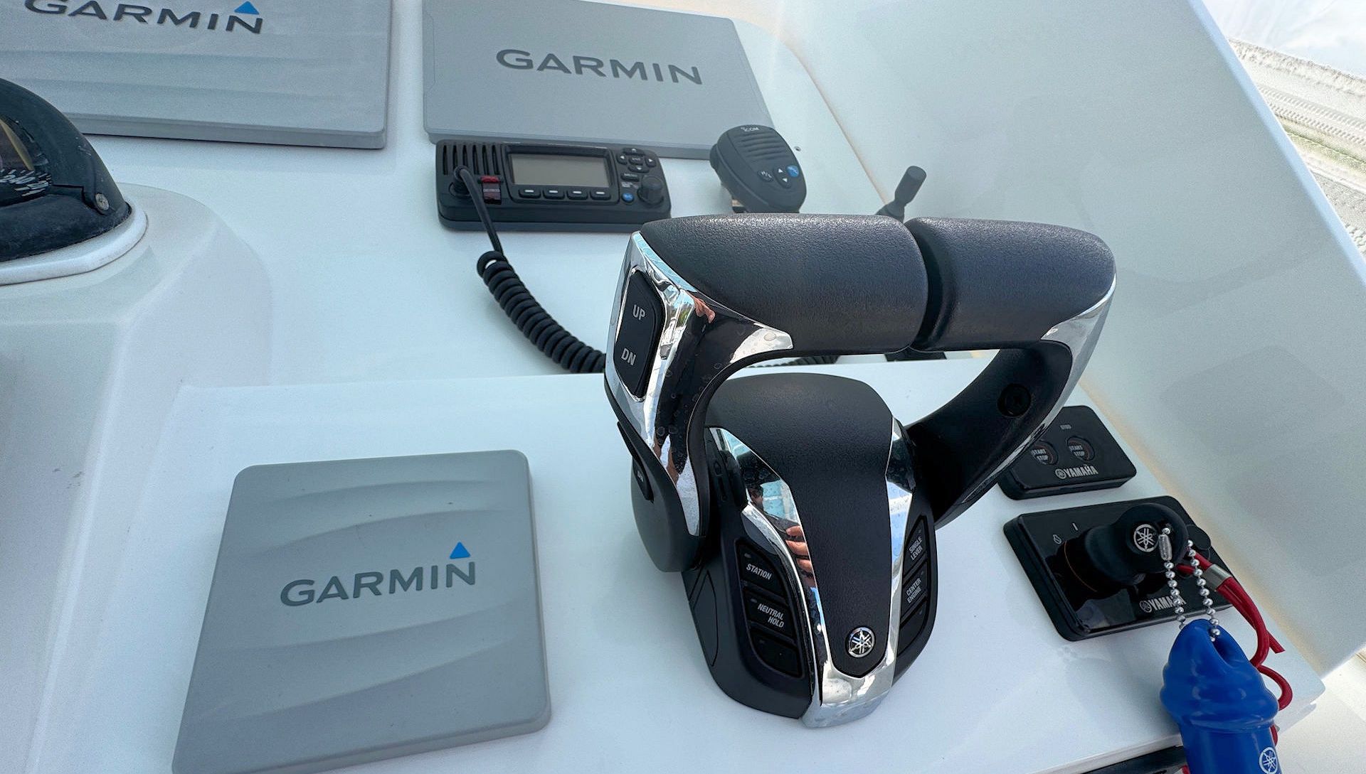 Garmin cycling gear and accessories displayed on a table, including a bike seat and electronic device.