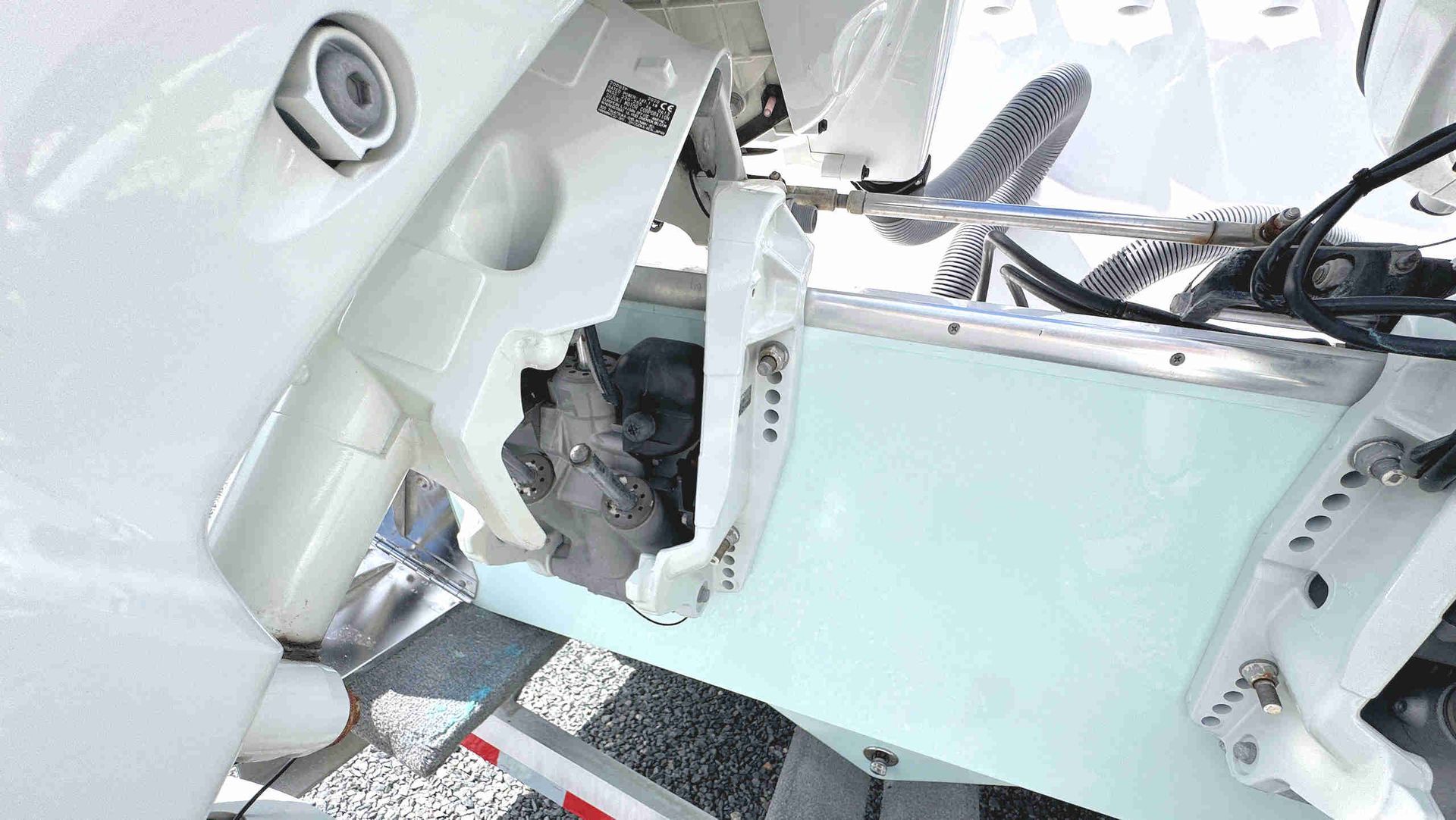 Outboard motor mounting brackets and associated equipment
