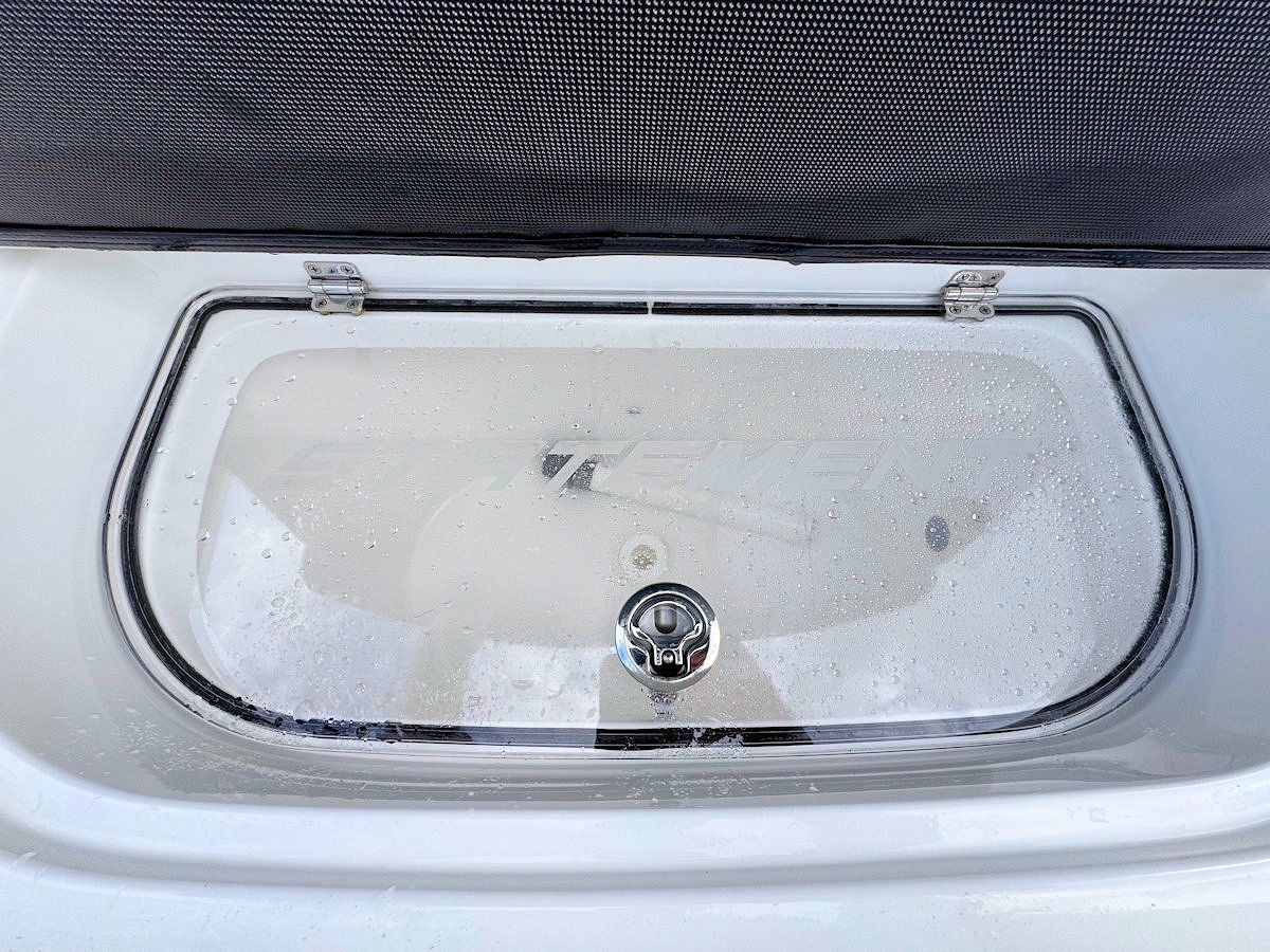 Livewell with transparent hinged cover.