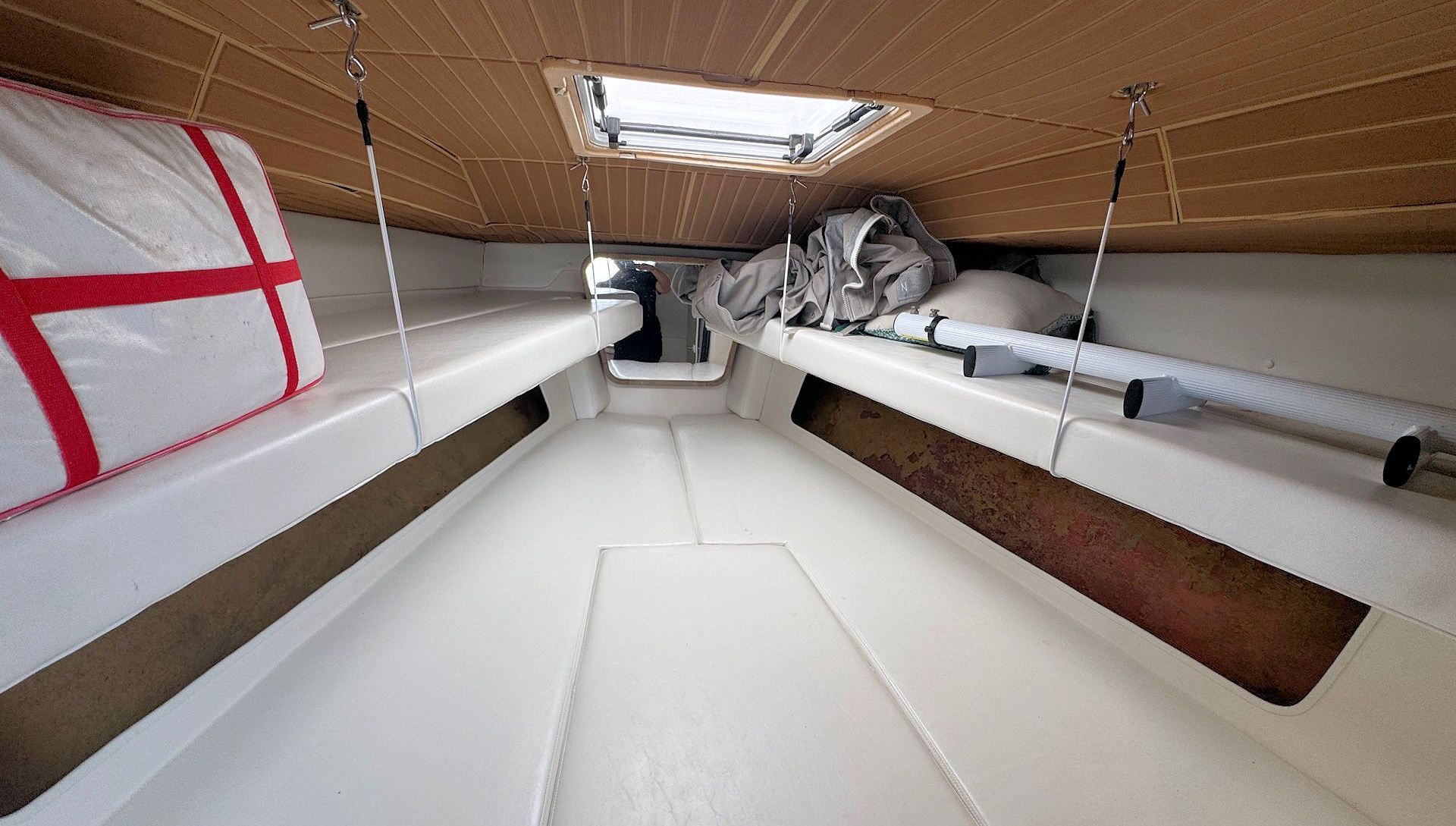 V-berth with suspended bunks on each side.