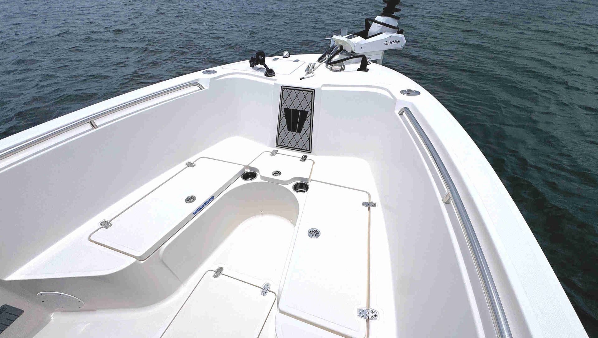 White boat bow with seating and anchor on calm water