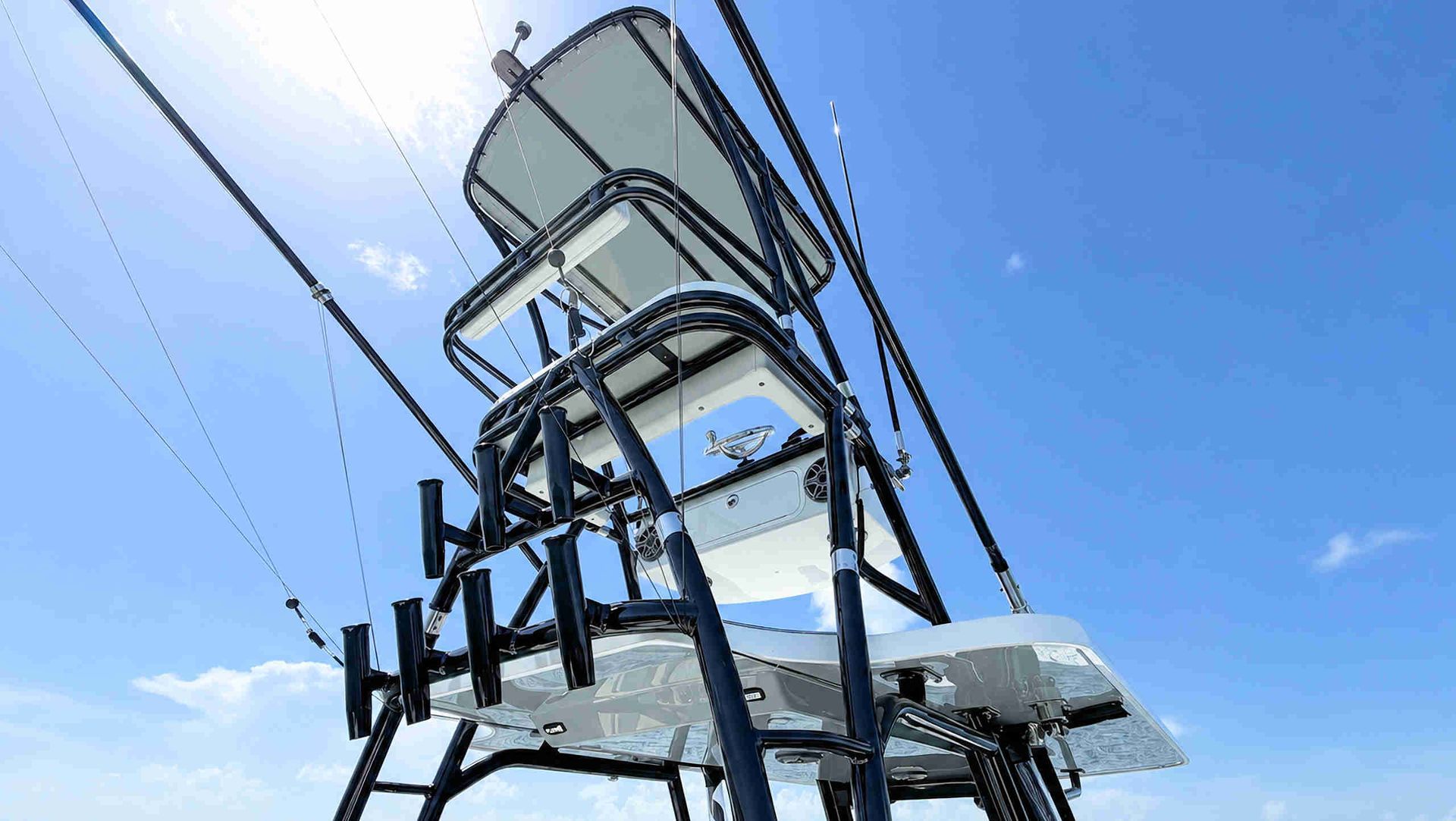 Tower and stacked metal structures against a blue sky.