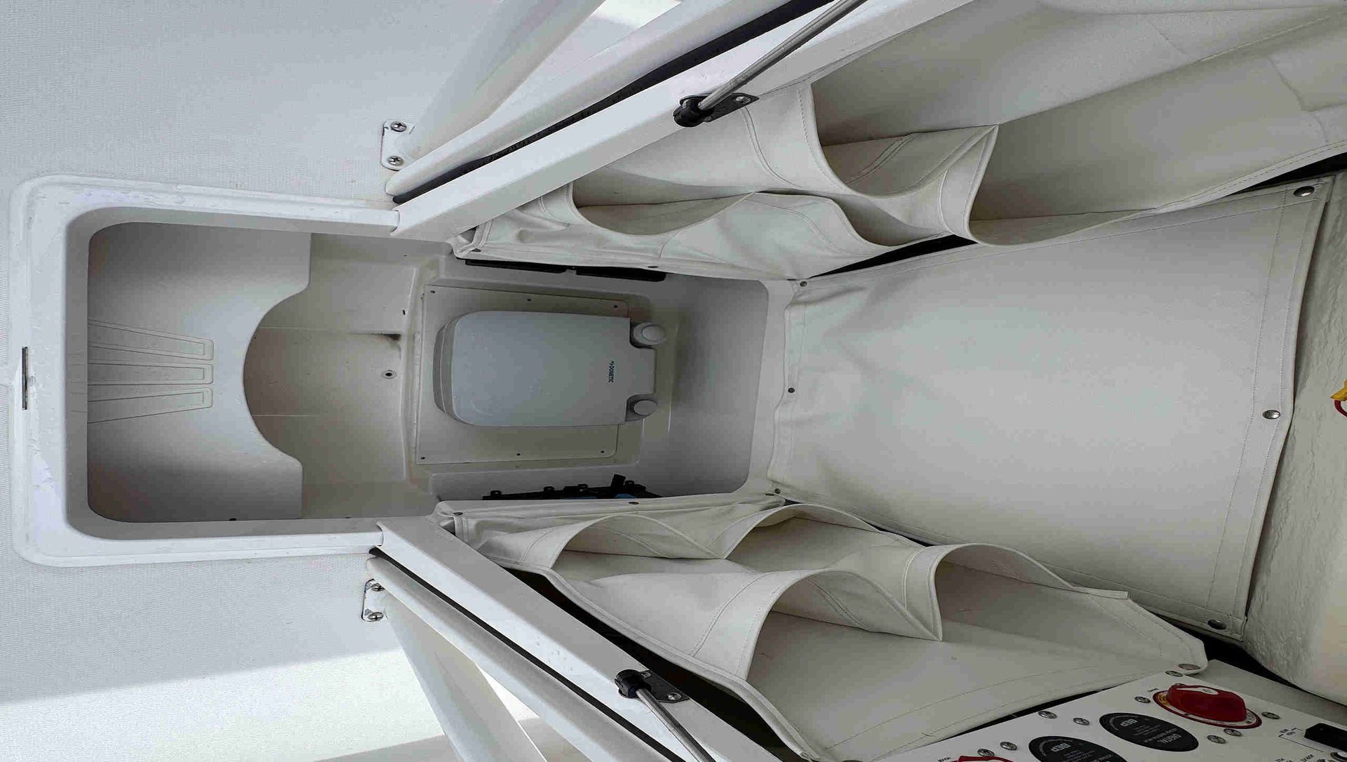 Center Console access to head with pocket storage.