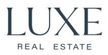 Logo for Luxe Real Estate featuring dark blue text that reads 