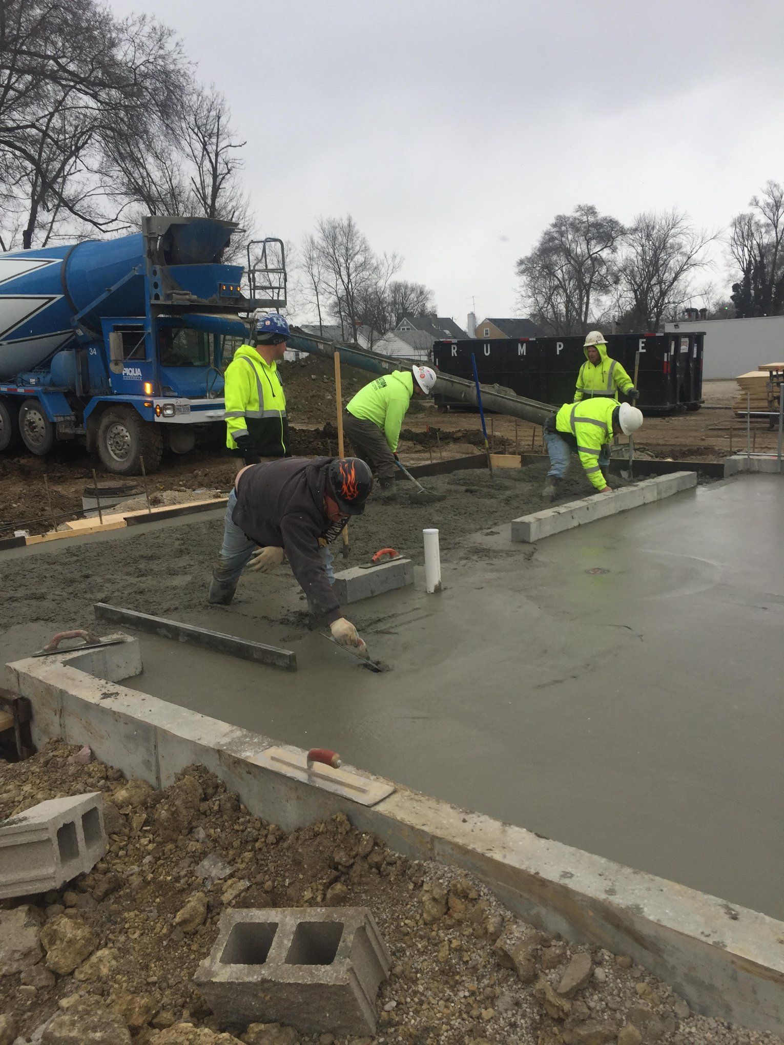 Men Works Concrete in Wide Lot — Wilmington, OH — TH Solutions, LLC