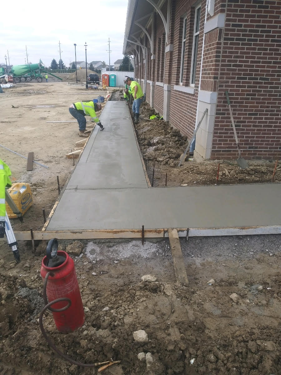 Two Men Finishing Concrete — Wilmington, OH — TH Solutions, LLC