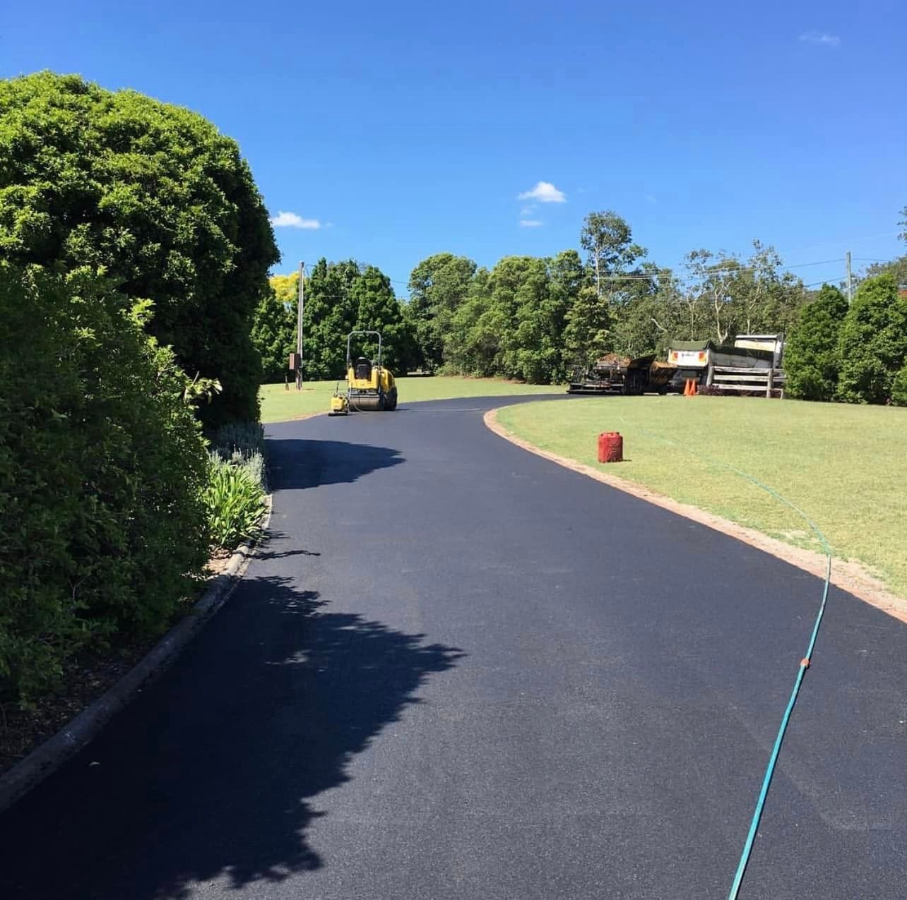 A road that is being paved in a field