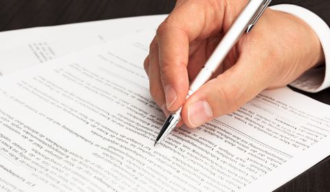 Signing property closing transaction in Lonoke, AR