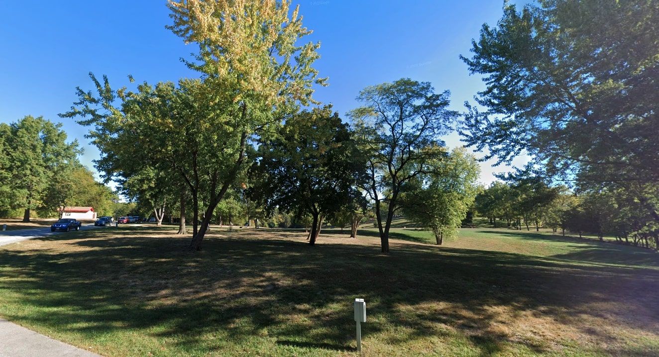 The outdoor scenery of Fort Zumwalt Park, MO, showing off its green trees and well maintained grass.