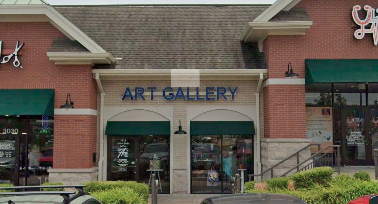 The exterior of the Lillian Yahn Gallery in O'Fallon, MO, showing its white brick built exterior.