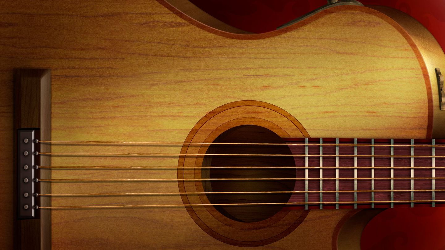 a close up of an acoustic guitar with a red background